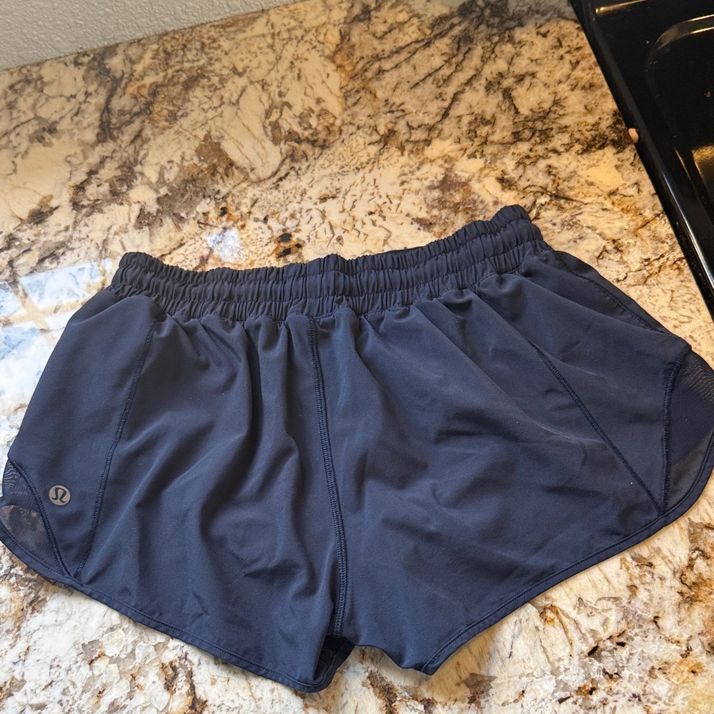 LULULEMON size 6 navy shorts .